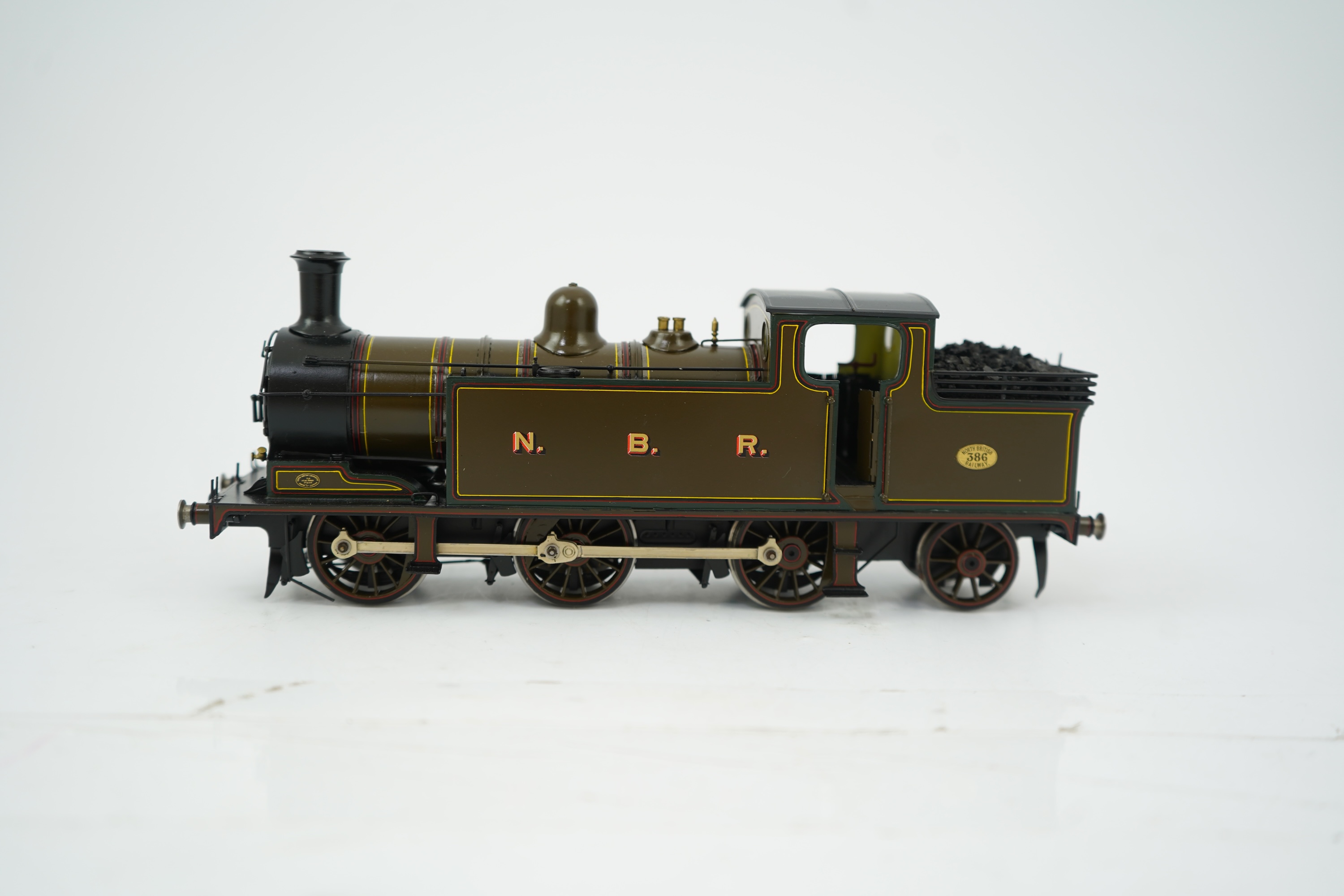 An 0 Gauge brass model of North British Railway William Reid Class A, 386, 0-6-2T locomotive, powered for two rail operation.